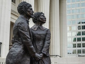 Statue of Former slave Dred and Harriet Scott sued for freedom in this courthouse, now offering tours and history exhibits.